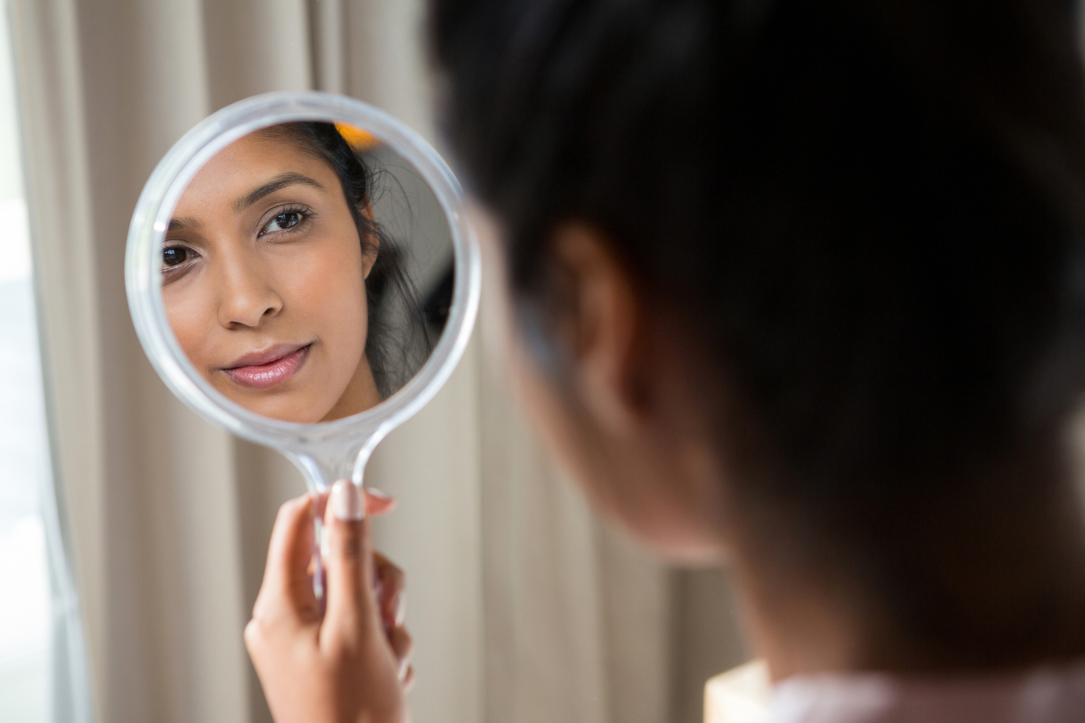Self-reflection and gaining clarity through virtual relationship coaching - woman participating in online coaching session for personal growth and confident decision-making